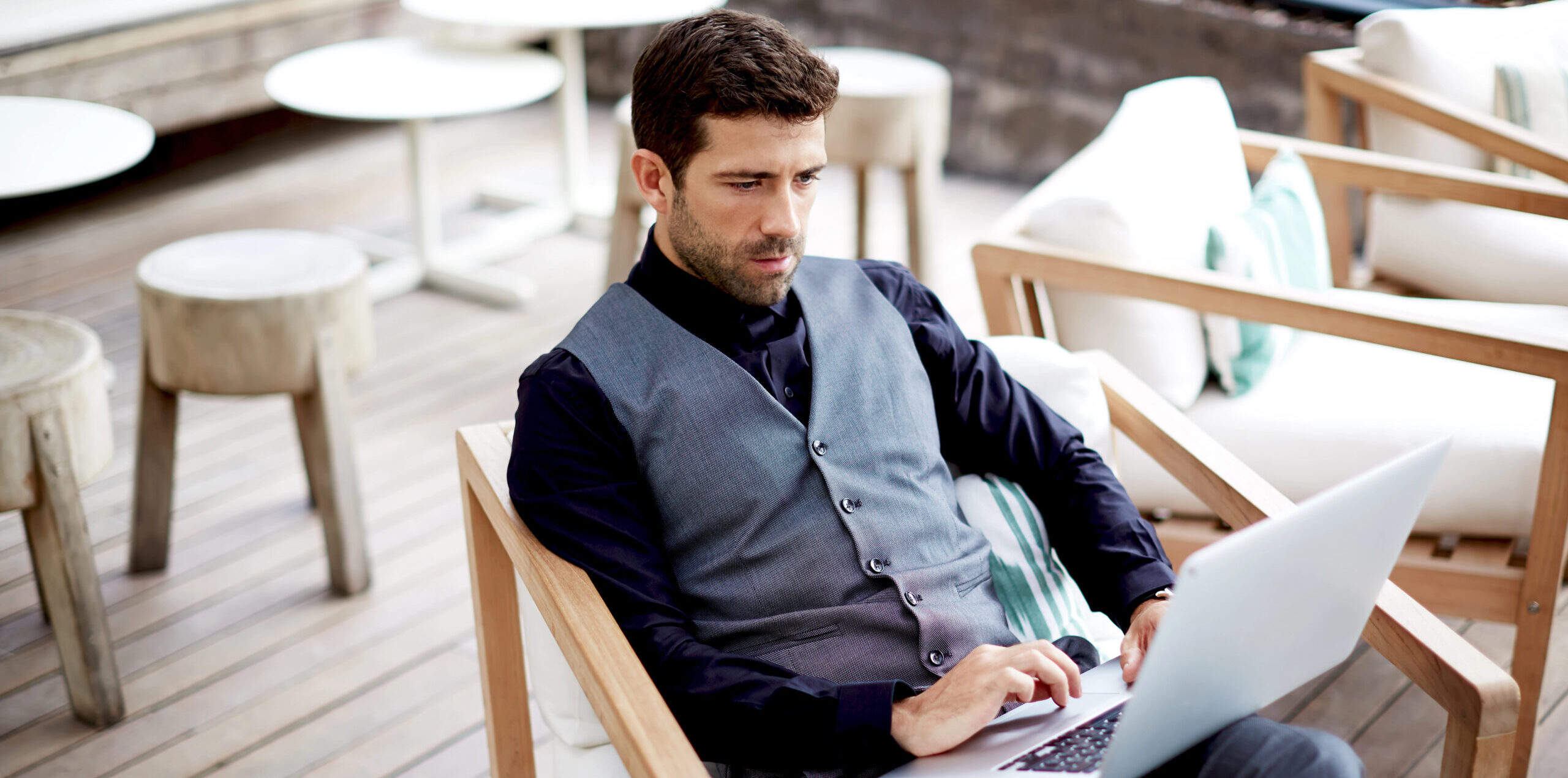 High-Net-Worth Individual working on laptop